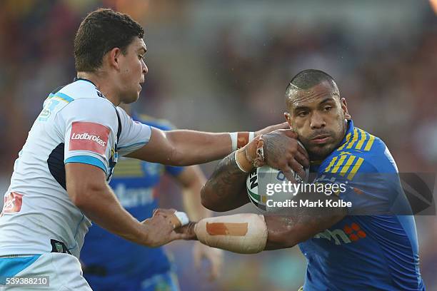 Ashley Taylor of the Titans tackles Manu Ma'u of the Eels during the round 14 NRL match between the Parramatta Eels and the Gold Coast Titans at TIO...