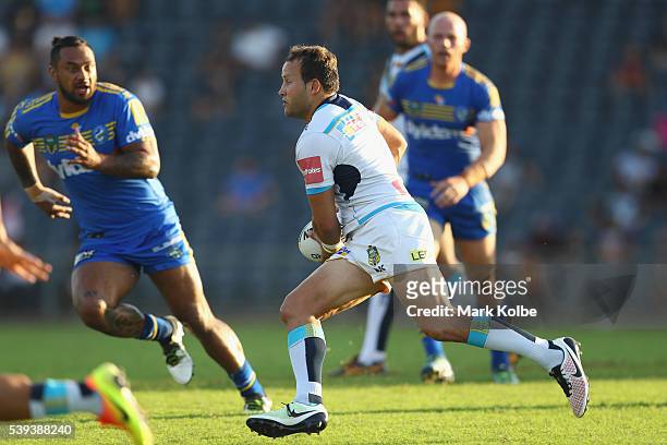 Tyrone Roberts of the Titans runs the ball during the round 14 NRL match between the Parramatta Eels and the Gold Coast Titans at TIO Stadium on June...