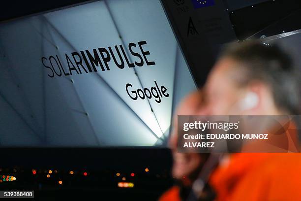 Swiss pilot Andre Borschberg and Swiss pilot Bertrand Piccard speak with the media after the successful landing of the Solar Impulse 2 aircraft at...