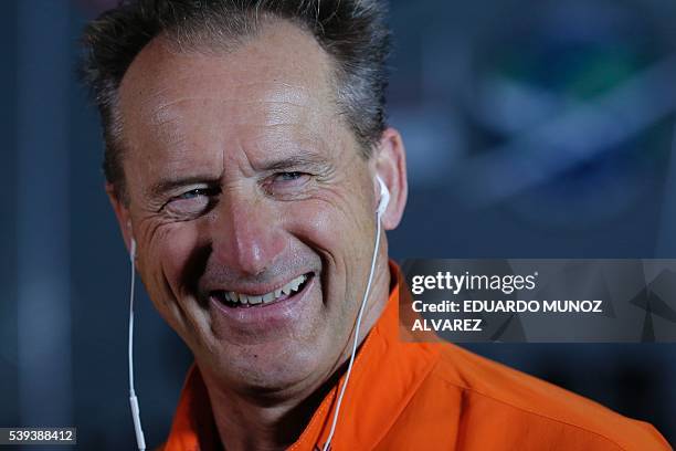 Swiss pilot Andre Borschberg looks on after the successful landing of the Solar Impulse 2 aircraft at JFK International Airport on June 11, 2016 in...