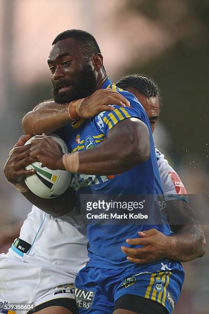 Semi Radradra of the Eels is tackled during the round 14 NRL match between the Parramatta Eels and the Gold Coast Titans at TIO Stadium on June 11,...