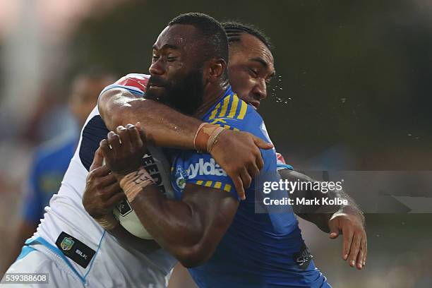 Semi Radradra of the Eels is tackled during the round 14 NRL match between the Parramatta Eels and the Gold Coast Titans at TIO Stadium on June 11,...