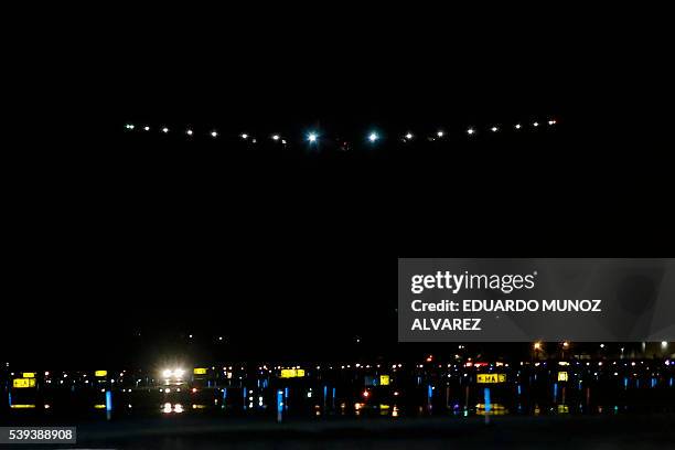 The Solar Impulse 2 aircraft makes its final approach for a successful landing by Swiss pilot Andre Borschberg at JFK International Airport on June...