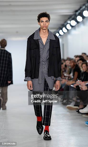 Model walks the runway at the Agi & Sam show during The London Collections Men SS17 at BFC Show Space on June 11, 2016 in London, England.