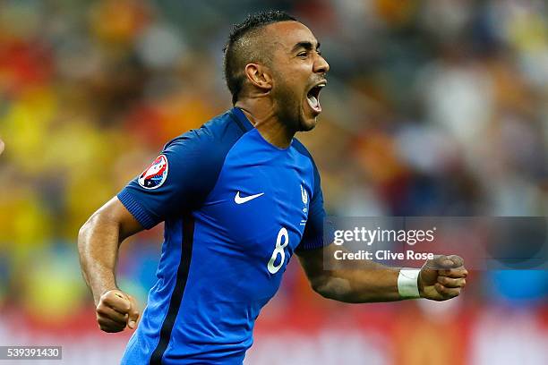 Dimitri Payet of France celebrates scoring his team's second goal during the UEFA Euro 2016 Group A match between France and Romania at Stade de...