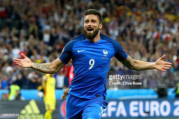 Olivier Giroud of France celebrates scoring his team's first goal during the UEFA Euro 2016 Group A match between France and Romania at Stade de...