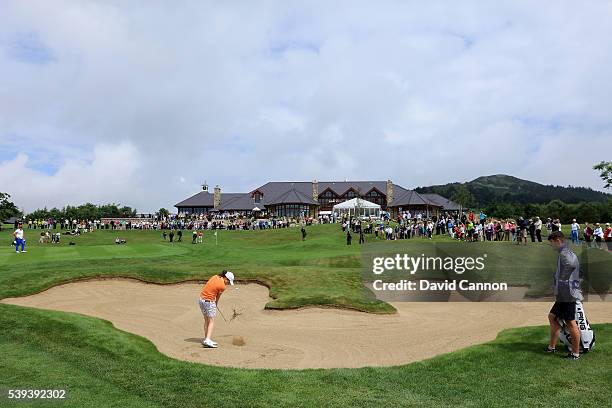 Leona Maguire of Ireland and the Great Britain and Ireland Team plays her third shot from the edge of the bunker short of the 18th green in her match...