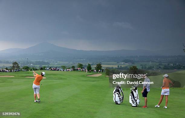 Maria Dunne of Ireland and the Great Britain and Ireland Team plays her second shot on the 9th holes in her match with Meghan MacLaren against Sierra...