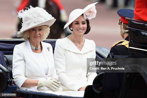 Camilla, Duchess of Cornwall and Catherine, Duchess of Cambridge sit in a carriage during the Trooping the Colour, this year marking the Queen's 90th...