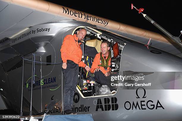 Solar Impulse founders and co- pilots Bertrand Piccard and Andre Borschberg celebrate their arrival at JFK airport on June 11, 2016 in New York City.