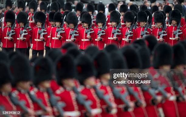 Members of The Foot Guards march in Horse Guards Parade during the Queen's Birthday Parade, 'Trooping the Colour', in London on June 11, 2016. -...