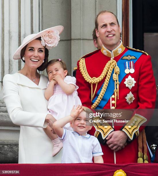 Catherine, Duchess of Cambridge, Princess Charlotte, Prince George, Prince William, Duke of Cambridge stand on the balcony during the Trooping the...