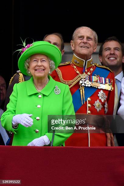 Queen Elizabeth II and Prince Philip, Duke of Edinburgh watch a fly past during the Trooping the Colour, this year marking the Queen's 90th birthday...