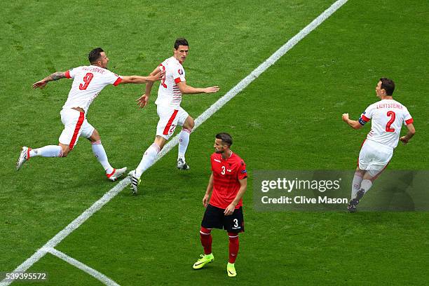 Fabian Schaer of Switzerland celebrates scoring his team's first goal with his team mates Haris Seferovic and Stephan Lichtsteiner during the UEFA...