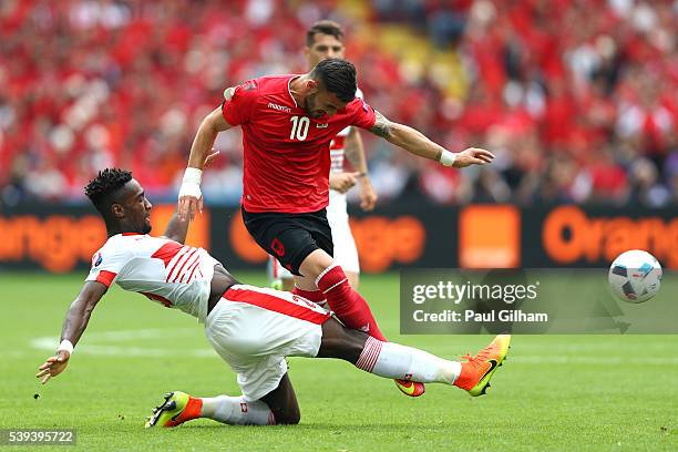 Armando Sadiku of Albania is challenged by Johan Djourou during the UEFA EURO 2016 Group A match between Albania and Switzerland at Stade...
