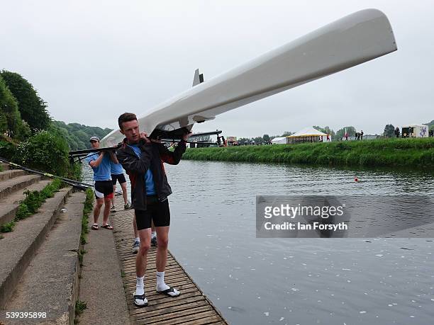 Rowing crew prepare to lower their boat into the water as they compete in the 183rd annual regatta on the River Wear on June 11, 2016 in Durham,...