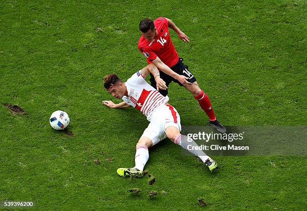 Granit Xhaka of Switzerland and Taulant Xhaka of Albania compete for the ball during the UEFA EURO 2016 Group A match between Albania and Switzerland...