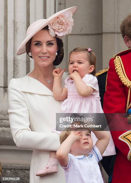 Catherine, Duchess of Cambridge with Princess Charlotte of Cambridge and Prince George of Cambridge during the Trooping the Colour, this year marking...