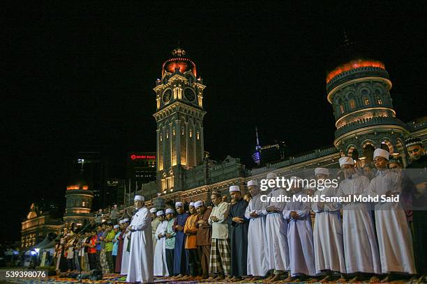 Muslims perform a special prayer called "taraweeh" in front of Sultan Abdul Samad building at Independent Square during the holy month of Ramadan on...