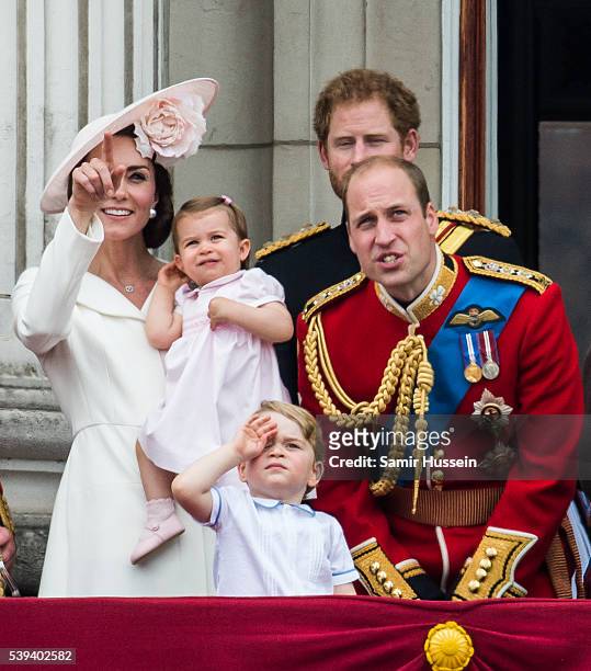 Catherine, Duchess of Cambridge, Princess Charlotte, Prince George, Prince Harry, Prince William, Duke of Cambridge stand on the balcony during the...