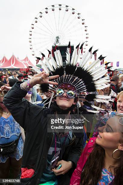 Festival goer in a Native American Headdress is seen in the crowd by the main stage on the first day of the Parklife Festival on June 11, 2016 in...