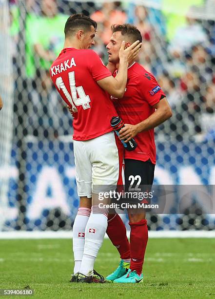 Granit Xhaka of Switzerland and Amir Abrashi of Albania embrace after the UEFA EURO 2016 Group A match between Albania and Switzerland at Stade...