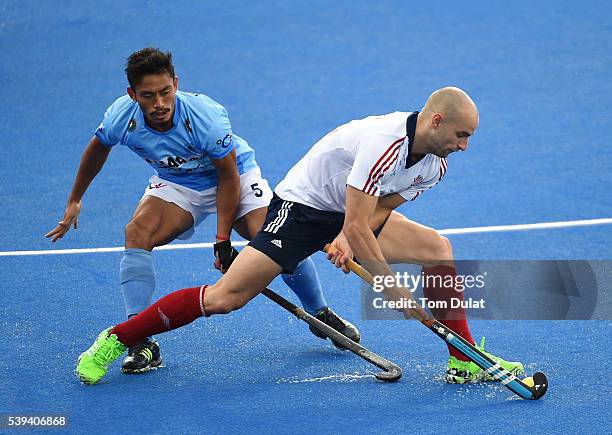 Nick Catlin of Great Britain and Kothajit Khadangbam of India in action during day two of the FIH Men's Hero Hockey Champions Trophy 2016 match...