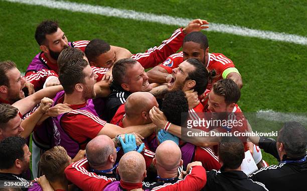 Gareth Bale of Wales celebrates scoring his team's first goal with his team mates during the UEFA EURO 2016 Group B match between Wales and Slovakia...