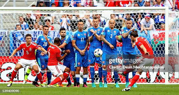 Gareth Bale of Wales scores his team's first goal from a free kick during the UEFA EURO 2016 Group B match between Wales and Slovakia at Stade Matmut...