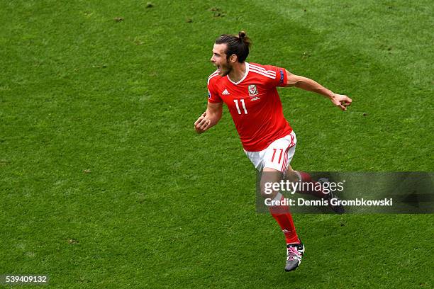 Gareth Bale of Wales celebrates scoring his team's first goal during the UEFA EURO 2016 Group B match between Wales and Slovakia at Stade Matmut...