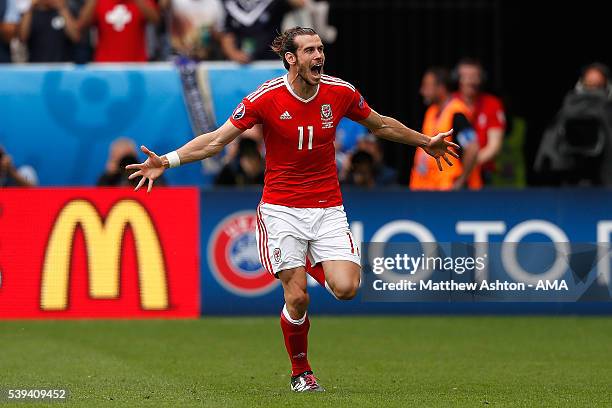 Gareth Bale of Wales celebrates scoring a goal to make the score 1-0 during the UEFA EURO 2016 Group B match between Wales and Slovakia at Stade...