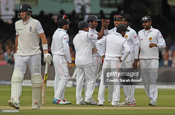 Sri Lanka celebrate as England's Joe Root is bowled by Nuwan Pradeep during day three of the 3rd Investec Test match between England and Sri Lanka at...