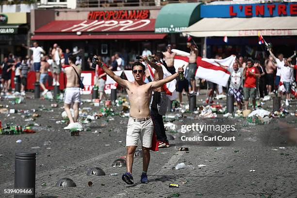 Rubbish lines the streets as England fans gather, cheer and clash with police ahead of the game against Russia later today on June 11, 2016 in...