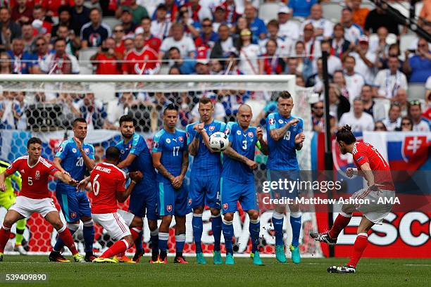 Gareth Bale of Wales scores a goal to make the score 1-0 during the UEFA EURO 2016 Group B match between Wales and Slovakia at Stade Matmut...