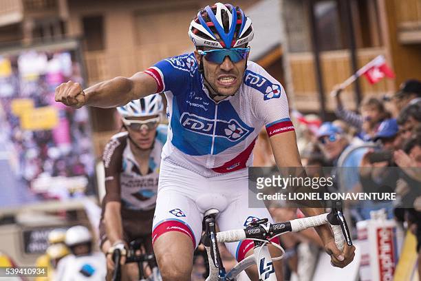 S French rider Thibaut Pinot celebrates his stage victory on the finish line during the seventh stage of the 68th edition of the Dauphine Criterium...