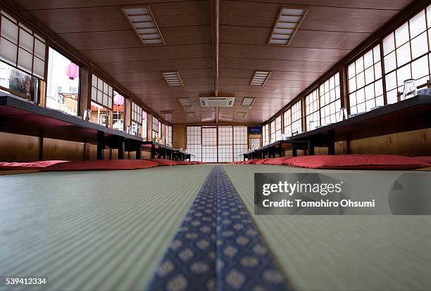 Tables are set inside a yakatabune, or traditional low barge style boat, operated by Mikawaya shipping agent, on June 11, 2016 in Tokyo, Japan. About...