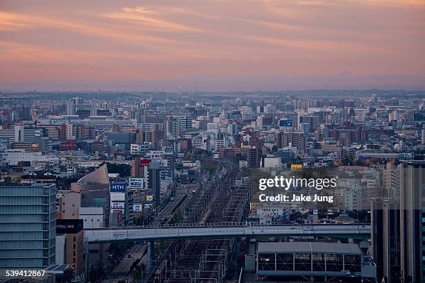 sunrise over nagoya station train tracks - nagoya bildbanksfoton och bilder