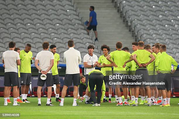 Joachim Loew, head coach of Germany talks to his players during a Germany training session at Stade Pierre-Mauray ahead of their opening UEFA EURO...