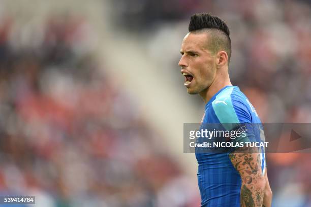 Slovakia's midfielder Marek Hamsik reacts during the Euro 2016 group B football match between Wales and Slovakia at the Stade de Bordeaux in Bordeaux...