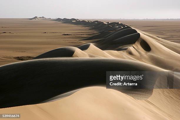 Sand dune belt and sunrise in the Erg of Bilma, a Dune Sea in the Tenere desert region of the south central Sahara, Niger, Western Africa.