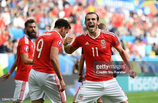 Gareth Bale of Wales celebrates his team's second goal scored by Hal Robson-Kanu during the UEFA EURO 2016 Group B match between Wales and Slovakia...