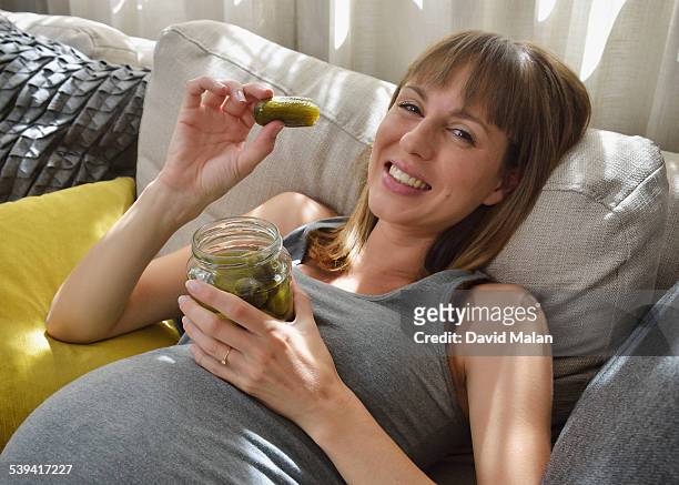 pregnant woman with a pickle - gratitude jar stock pictures, royalty-free photos & images