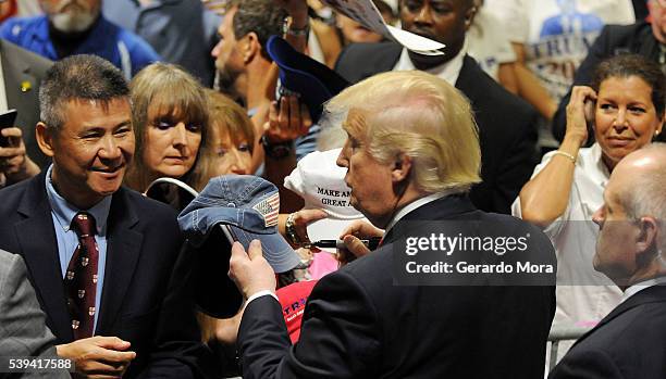 Republican presidential candidate Donald Trump greets supporters during a campaign rally at the Tampa Convention Center on June 11, 2016 in Tampa,...