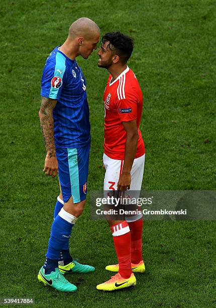 Martin Skrtel of Slovakia and Neil Taylor of Wales face off during the UEFA EURO 2016 Group B match between Wales and Slovakia at Stade Matmut...