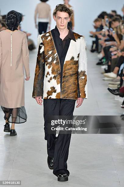 Model walks the runway at the Agi & Sam Spring Summer 2017 fashion show during London Menswear Fashion Week on June 11, 2016 in London, United...