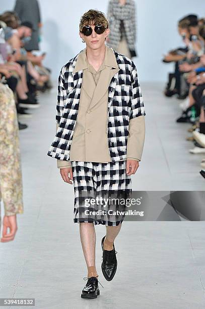 Model walks the runway at the Agi & Sam Spring Summer 2017 fashion show during London Menswear Fashion Week on June 11, 2016 in London, United...