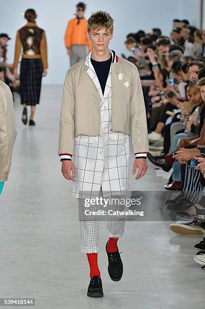 Model walks the runway at the Agi & Sam Spring Summer 2017 fashion show during London Menswear Fashion Week on June 11, 2016 in London, United...