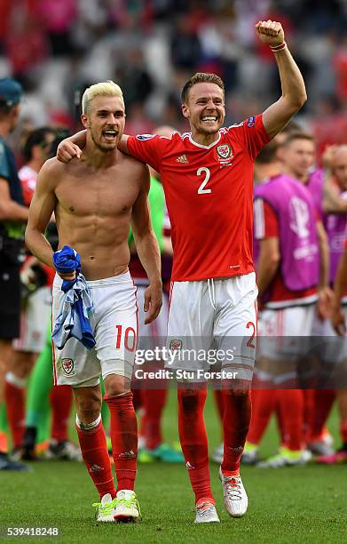 Aaron Ramsey and Chris Gunter of Wales celebrate their team's 2-1 win in the UEFA EURO 2016 Group B match between Wales and Slovakia at Stade Matmut...