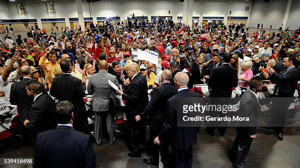 Republican presidential candidate Donald Trump greets supporters during a campaign rally at the Tampa Convention Center on June 11, 2016 in Tampa,...