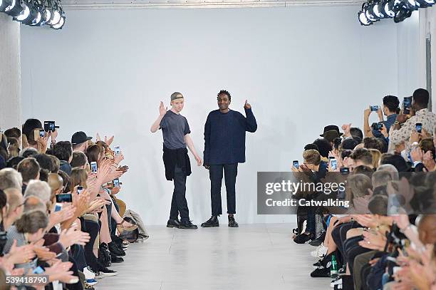 Fashion designers Sam Cotton and Agape Mdumulla walk the runway at the Agi & Sam Spring Summer 2017 fashion show during London Menswear Fashion Week...